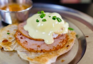 melted cheese on top of cooked ham