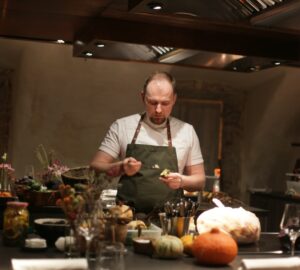 man standing in front of desk