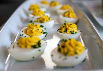 white and yellow icing covered cupcakes