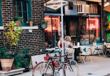red bicycle park on gray road