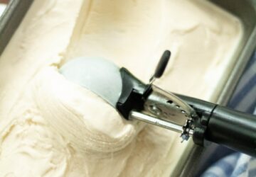 white and gray textile on white ceramic sink