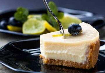 sliced cake on black plate