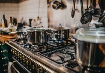 stainless steel cooking pots on gas stove