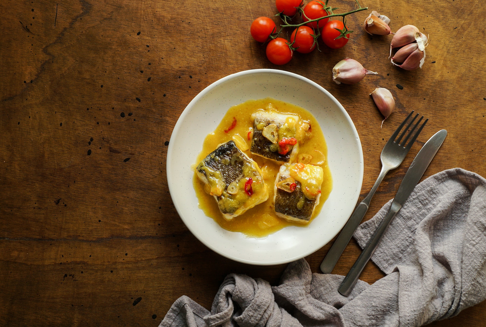 bacalao al pil pil, salted cod in emulsified olive oil sauce, spanish cuisine, basque country