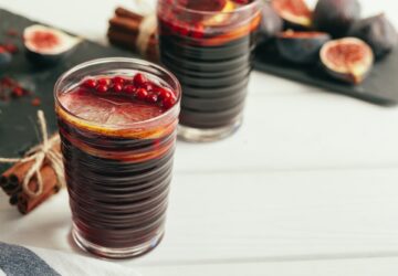 New Year composition with mulled wine on dark wooden background