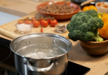 Metallic pan with boiling water and spaghetti